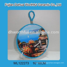 Round ceramic pot holder with blue lifting rope